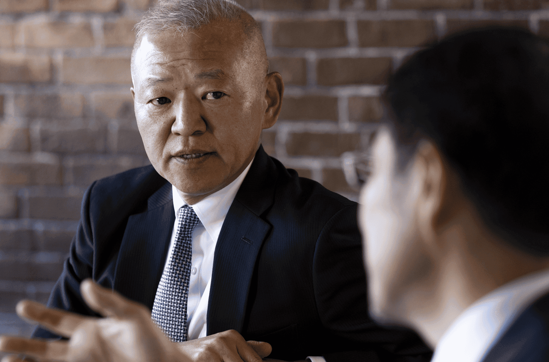 副社長執行役員 宮本義久が語る様子
